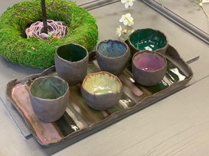 A set of THREE dark ceramic mini bowls and a tray