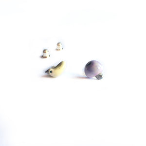 Mismatched ceramic earrings “Mint green bird and its levender apple”