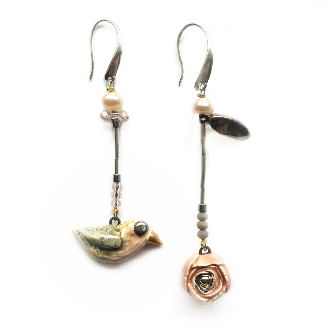 Ceramic assymmetric earrings “Bird and a rose with a leaf”
