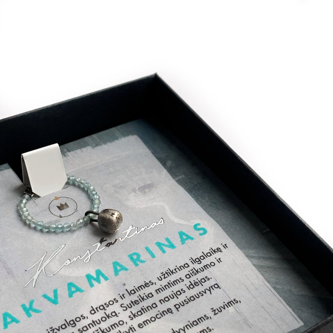 Beaded aquamarine ring with a black porcelain pendant KONSTANTINAS