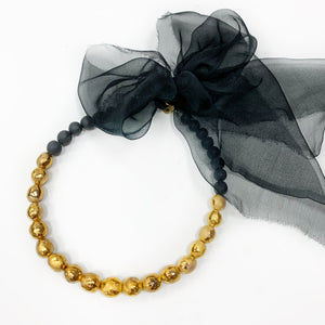 Especially precious black porcelain necklace with silk ribbon