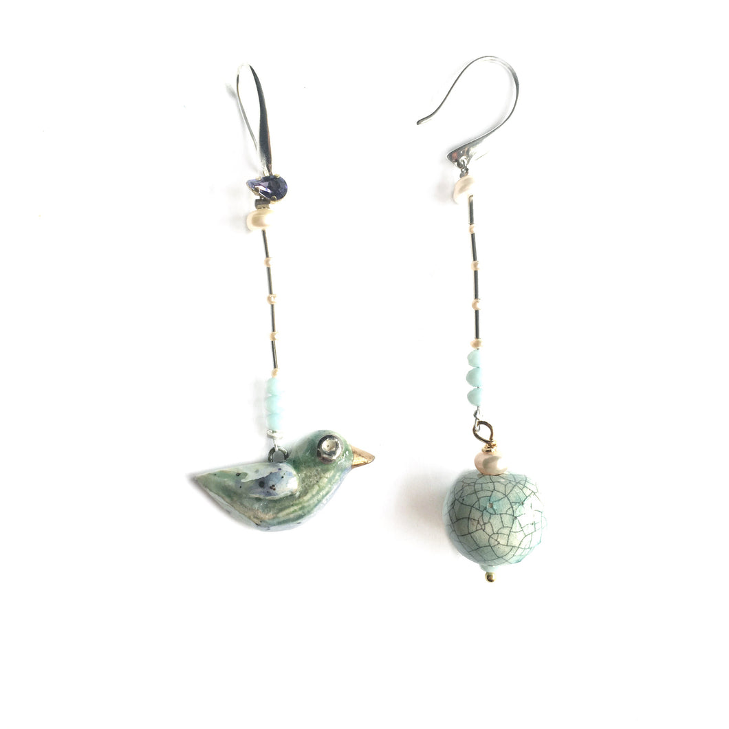 Ceramic mismatched earrings “Bird and its world”