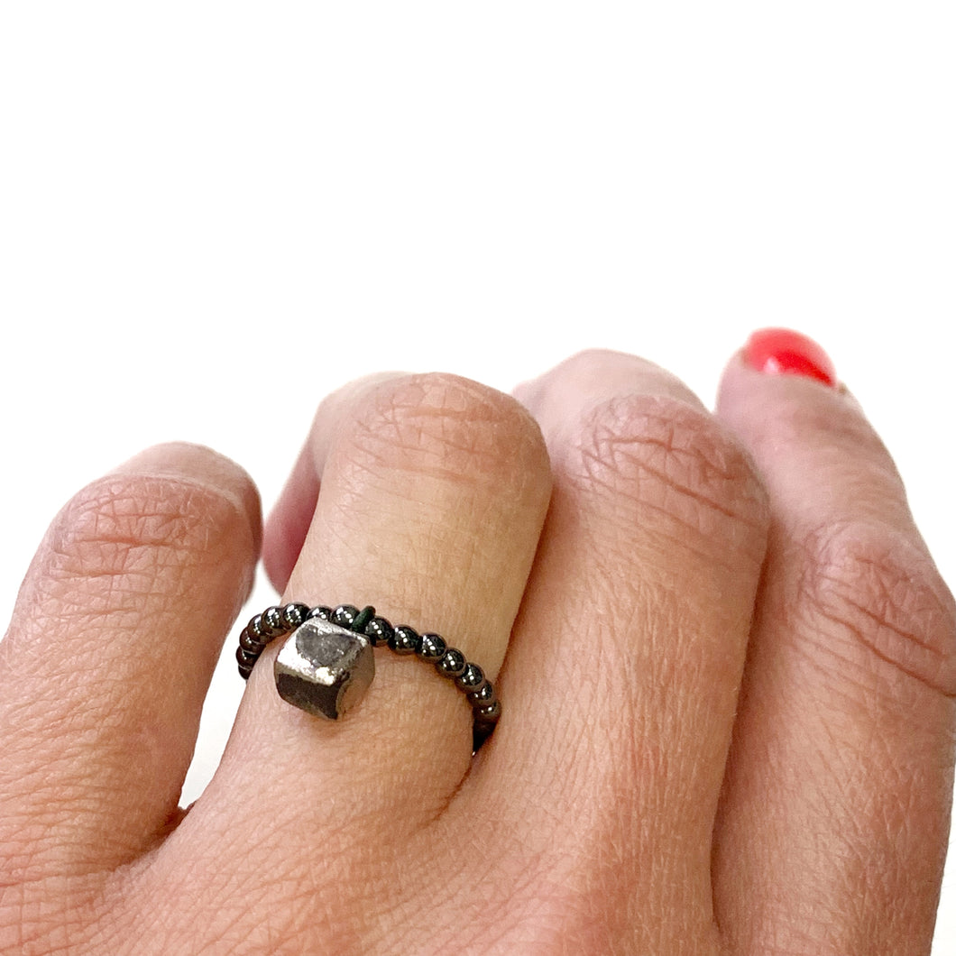 Hematite beads ring with a platinum plated black porcelain cube 