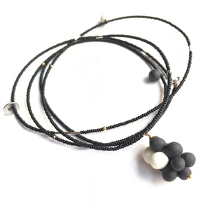 Long black and white porcelain pendant “Molecula”