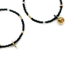 Hoop beaded earrings with a golden black porcelain bubble