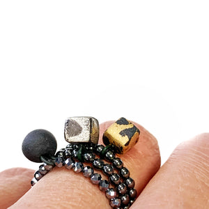 Hematite beads ring with a gold plated black porcelain cube  "LEONARDO"