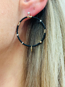 Hoop beaded earrings with a golden black porcelain bubble